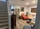 Inviting living room featuring hardwood floors, stylish furniture, and warm, inviting lighting at 2353 Wellington Cir, Lithonia, GA 30058