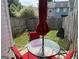 Cozy patio area with outdoor furniture and a well-maintained fenced yard at 2353 Wellington Cir, Lithonia, GA 30058