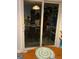 Patio door showing a kitchen area with dining table and view to outside at 2353 Wellington Cir, Lithonia, GA 30058