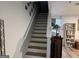 Stairway view to the second level, complemented by a light interior and wood flooring at 2353 Wellington Cir, Lithonia, GA 30058