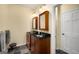 This bathroom features a dark wood vanity, a black countertop, and a gray slate floor at 1928 Main Nw St, Atlanta, GA 30318