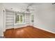 This bedroom has hardwood floors, built-in shelves, and a window with natural light coming into the space at 1928 Main Nw St, Atlanta, GA 30318