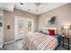 The bedroom features double doors that lead to a patio and built in shelving next to the bed at 1928 Main Nw St, Atlanta, GA 30318