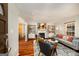 Stylish living room featuring a gray sofa, fireplace, decor, and an open layout with hardwood flooring at 1928 Main Nw St, Atlanta, GA 30318