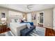Well-lit main bedroom with a tufted headboard bed, and decorative rug, creating a relaxing atmosphere at 1928 Main Nw St, Atlanta, GA 30318