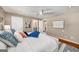 Cozy main bedroom with a ceiling fan, a ensuite bathroom, and a bright atmosphere at 1928 Main Nw St, Atlanta, GA 30318