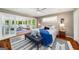 Comfortable main bedroom with natural light, ceiling fan, and an adjacent sunroom for relaxation at 1928 Main Nw St, Atlanta, GA 30318