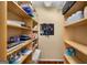 This walk-in pantry features wooden shelving and storage throughout at 1928 Main Nw St, Atlanta, GA 30318