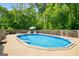 Backyard swimming pool surrounded by wood deck and a fenced in yard in a neighborhood at 1928 Main Nw St, Atlanta, GA 30318