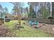 The home includes a spacious backyard with a charming patio area and privacy fence at 200 Doe Run, Peachtree City, GA 30269
