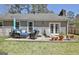 Home's backyard features a cozy patio area and outdoor seating at 200 Doe Run, Peachtree City, GA 30269