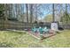 Backyard with privacy fence and Adirondack seating area at 200 Doe Run, Peachtree City, GA 30269