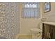 Cozy bathroom showcases patterned shower curtain and window curtain with white beadboard paneling at 200 Doe Run, Peachtree City, GA 30269