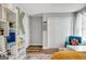 Bedroom with hardwood floors, a display bookshelf, and closet with bi-fold doors at 200 Doe Run, Peachtree City, GA 30269