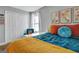 Bedroom features hardwood floors, a double door closet, and a vibrant color scheme at 200 Doe Run, Peachtree City, GA 30269