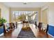 Dining room table setting by large window provides natural light at 200 Doe Run, Peachtree City, GA 30269