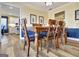 Dining room featuring wood chairs and table with view of the kitchen at 200 Doe Run, Peachtree City, GA 30269