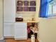 Bright home office with blue curtains, shelving, desk space, and white cabinets for ample storage at 200 Doe Run, Peachtree City, GA 30269