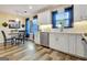 Well-lit kitchen with stainless steel appliances, eat-in table and chairs and stylish decor at 200 Doe Run, Peachtree City, GA 30269