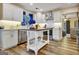 Bright kitchen with stainless steel appliances, white cabinets, tile backsplash and butcher block island at 200 Doe Run, Peachtree City, GA 30269