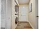 Convenient laundry area with stacked washer and dryer, closet, and ample storage space at 200 Doe Run, Peachtree City, GA 30269