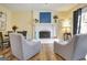Inviting living room featuring a brick fireplace, comfortable seating, and wood floors at 200 Doe Run, Peachtree City, GA 30269