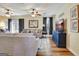 Spacious living room with wood floors, comfortable seating, and a TV for entertainment at 200 Doe Run, Peachtree City, GA 30269