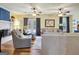 Inviting living room featuring a fireplace, hardwood floors, ceiling fans, and neutral decor at 200 Doe Run, Peachtree City, GA 30269