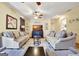 Spacious living room with hardwood floors, comfortable sofas, and ample natural light at 200 Doe Run, Peachtree City, GA 30269