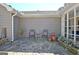Charming stone patio with wrought iron seating and decorative planters offering an inviting outdoor space at 200 Doe Run, Peachtree City, GA 30269