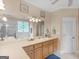 Spacious bathroom featuring a shower, a bathtub, a large mirror, and a long countertop with double sinks at 1103 Wilder Ct, Mcdonough, GA 30252