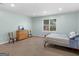 Bedroom features a blue-striped bed, dresser, and two chairs, with a window providing natural light at 1103 Wilder Ct, Mcdonough, GA 30252