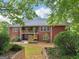 Beautiful brick home exterior featuring a spacious back porch and well-maintained landscaping at 1103 Wilder Ct, Mcdonough, GA 30252
