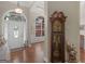 Welcoming foyer with hardwood floors, arched doorways, and a classic grandfather clock adding a touch of elegance at 1103 Wilder Ct, Mcdonough, GA 30252