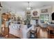 Spacious living room featuring hardwood floors, a fireplace, neutral tones, and large windows offering natural light at 1103 Wilder Ct, Mcdonough, GA 30252