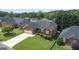 Aerial shot of brick home featuring manicured lawn and attached garage at 375 Oakpark Ter, Mcdonough, GA 30253