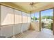 Inviting back porch with screened windows and lovely natural light at 375 Oakpark Ter, Mcdonough, GA 30253