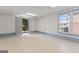 Finished basement with access to the exterior and natural light from windows at 375 Oakpark Ter, Mcdonough, GA 30253