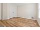 Bedroom with wood-look floors, closet, and natural light at 375 Oakpark Ter, Mcdonough, GA 30253