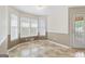 Sun-filled breakfast nook with tiled floors, large windows, and access to the patio at 375 Oakpark Ter, Mcdonough, GA 30253