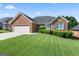 Charming brick home with well-manicured lawn and two-car garage at 375 Oakpark Ter, Mcdonough, GA 30253