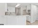 Stylish kitchen with white cabinets, quartz counters, and stainless steel appliances at 375 Oakpark Ter, Mcdonough, GA 30253