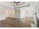 Open living room showcasing the wood floors, trey ceilings, recessed lights, and fireplace at 375 Oakpark Ter, Mcdonough, GA 30253