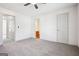 Bright bedroom with carpet, ceiling fan and adjacent bathroom for convenience at 2047 Charter Ln, Lithonia, GA 30058