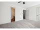 Bedroom with ceiling fan and access to the bathroom and other rooms at 2047 Charter Ln, Lithonia, GA 30058