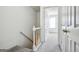 Bright hallway with carpeted floors, neutral walls, and white doors to other rooms at 2047 Charter Ln, Lithonia, GA 30058