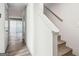 Hallway featuring wood-look flooring and staircase with white railing, leading to other rooms at 2047 Charter Ln, Lithonia, GA 30058