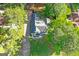 An aerial view of the property showing the home, driveway, and surrounding trees at 1291 Interlaken Pass, Jonesboro, GA 30238