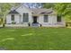 Charming single-story home with manicured lawn and classic black trimmed windows at 1291 Interlaken Pass, Jonesboro, GA 30238