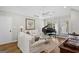 Elegant living room featuring hardwood floors, neutral colors, and grand piano at 1291 Interlaken Pass, Jonesboro, GA 30238